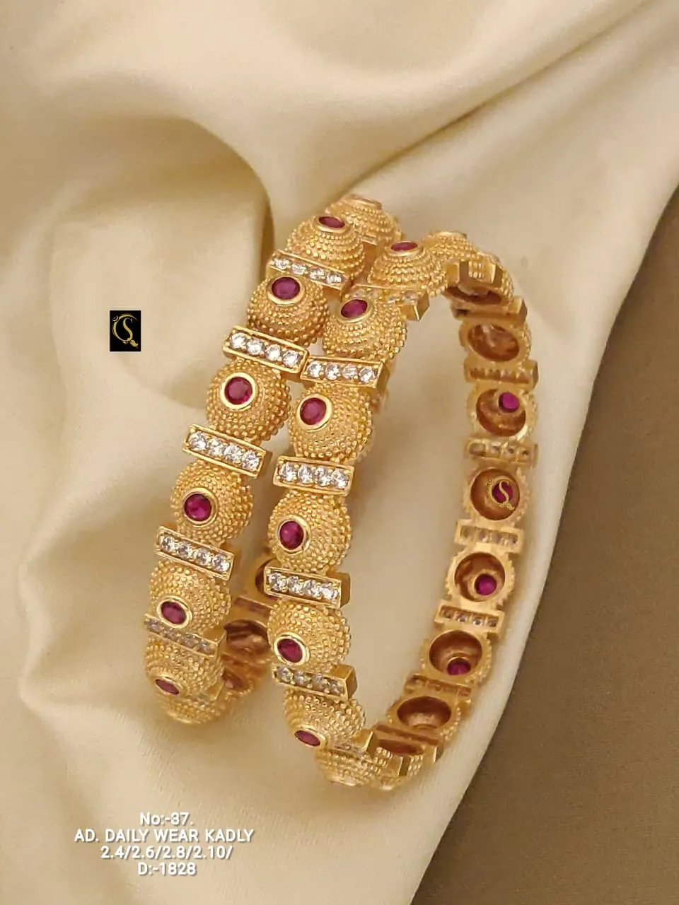 Heavy look kadli bangles with ruby stones and cz shine