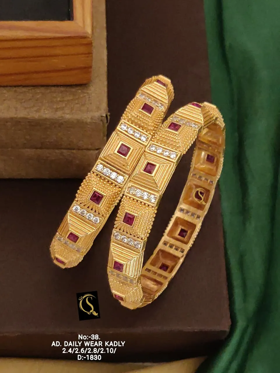Geometric pattern kadli bangles with ruby and cz highlights