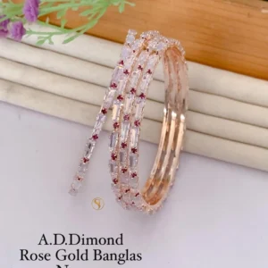 Rose gold kadli bangles with ruby stone highlights