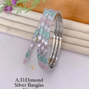 Golden bangles with ruby accent stones