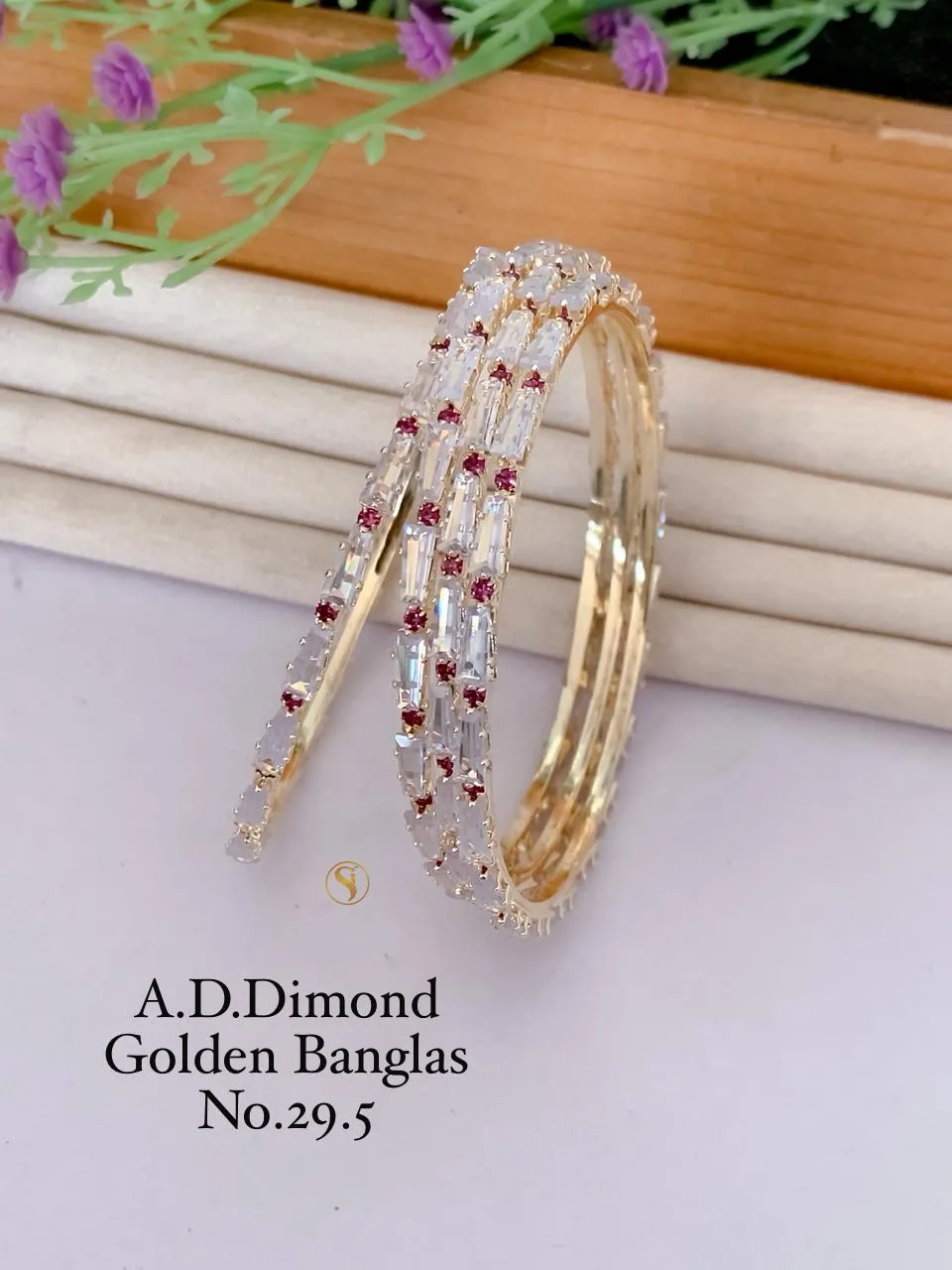 Golden bangles with sparkling stone floral pattern