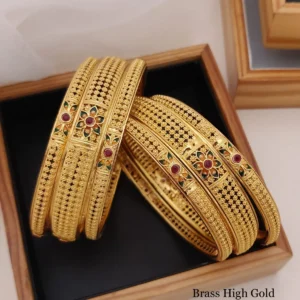 Brass high gold chudla bangles with floral stone centerpiece and rich ethnic pattern