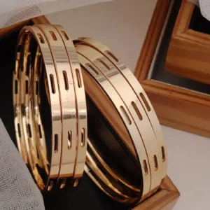 High polish sleek designer cut pattern gold bangles for daily wear