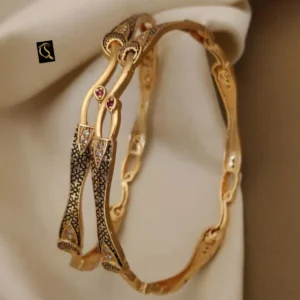 Designer kadli bangles with black pattern detailing and modern curves