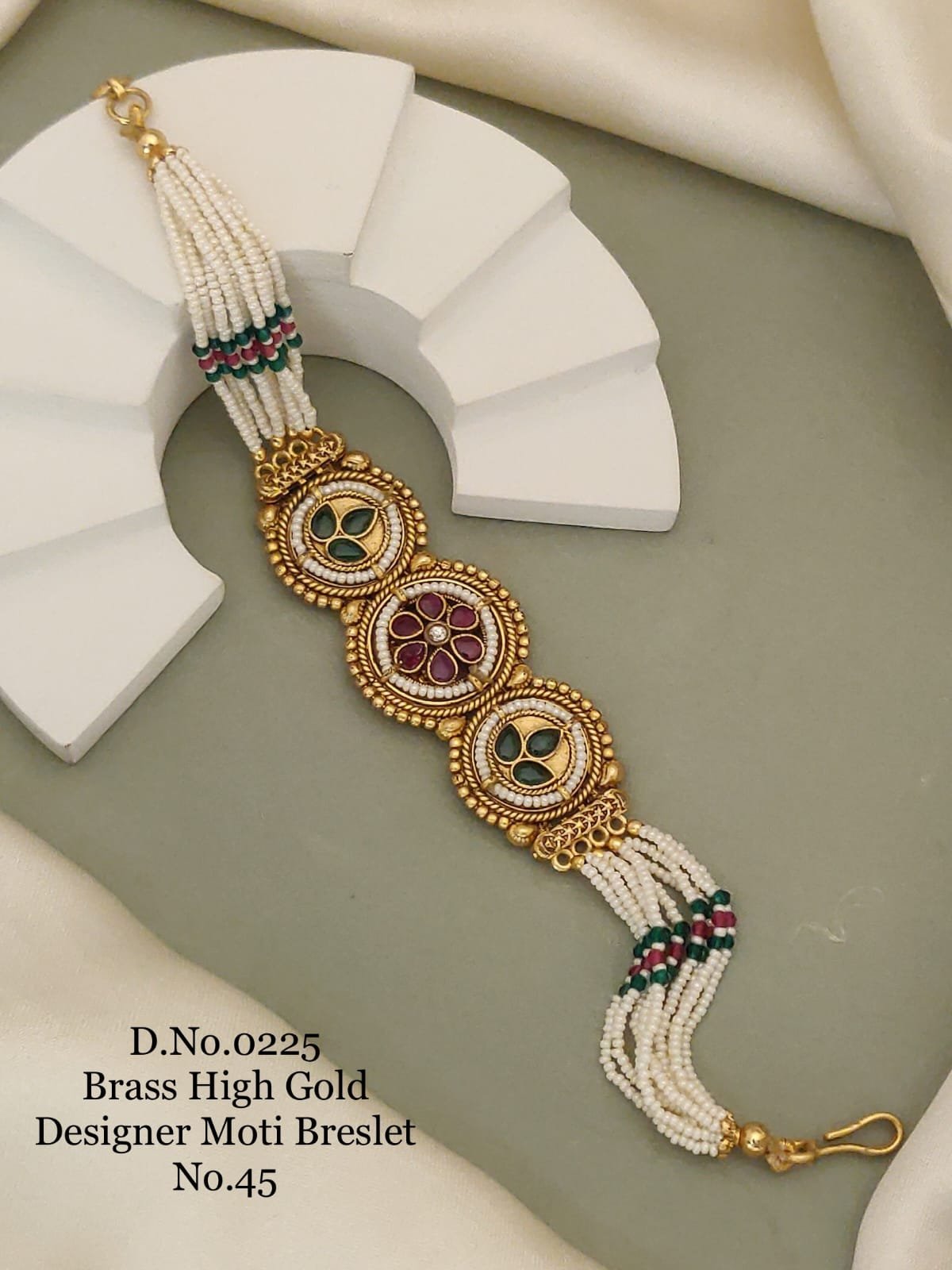 Brass high gold designer multi motif moti bracelet