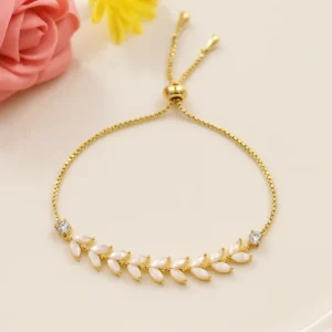 Gold bracelet with white leaf pattern stones