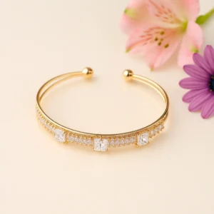 Gold cuff bracelet with square crystal accents in a classic line