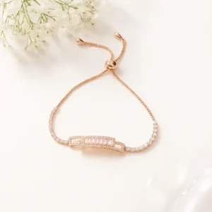 Rose gold bracelet with pink baguette centerpiece and crystal border
