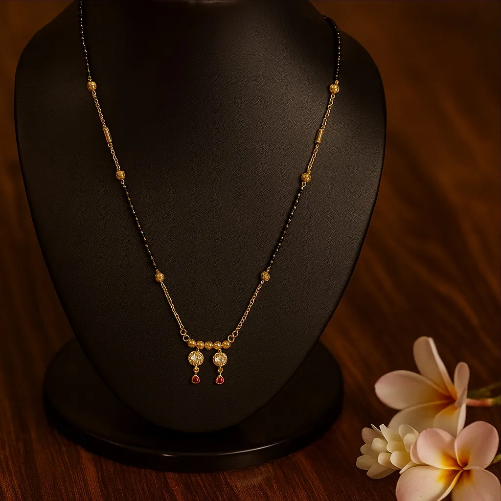 Gold plated mangalsutra with double heart design and red stone drops