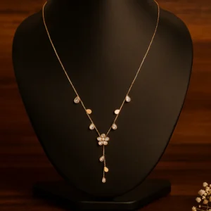 Star and flower pendant necklace with sparkling stone drops in gold polish